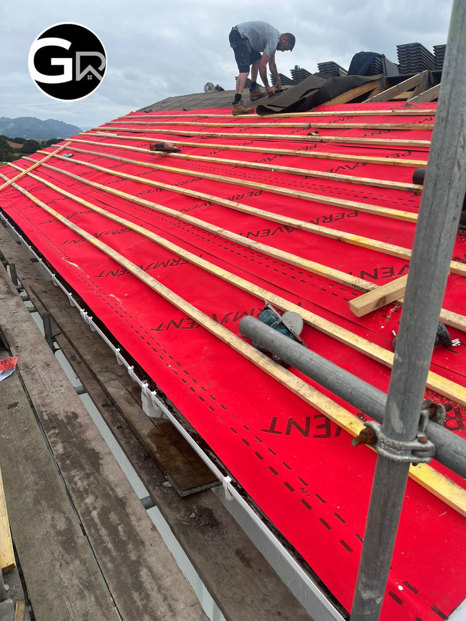 Installation of new tiles roof.